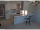 Kitchen with tile flooring, a breakfast bar, and white cabinetry at 2179 E Palmcroft Dr, Tempe, AZ 85282