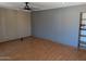 Spacious living room area featuring hardwood flooring and a ceiling fan at 2179 E Palmcroft Dr, Tempe, AZ 85282