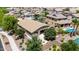 Beautiful aerial view of backyard with manicured landscaping, pool, and covered patio at 2507 E Eleana Ln, Gilbert, AZ 85298
