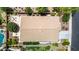Straight down aerial view of large backyard with stone patio, pool, and well-maintained roof at 2507 E Eleana Ln, Gilbert, AZ 85298