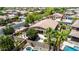 Backyard aerial view of a home with a lovely patio, luxurious pool, and spa at 2507 E Eleana Ln, Gilbert, AZ 85298