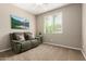 Bright living room with a couch and window, creating a comfortable and inviting space at 2507 E Eleana Ln, Gilbert, AZ 85298