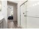 Well-lit bathroom featuring gray cabinets, and a glass-enclosed shower at 300 N Gila Springs Blvd # 181, Chandler, AZ 85226