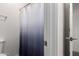 Bathroom featuring an aesthetic blue shower curtain and brushed nickel hardware at 300 N Gila Springs Blvd # 181, Chandler, AZ 85226