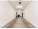 Spacious two car garage with white walls and ceiling offering ample storage and parking space at 300 N Gila Springs Blvd # 181, Chandler, AZ 85226