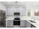 Well-equipped kitchen with stainless steel appliances and gray cabinets at 300 N Gila Springs Blvd # 181, Chandler, AZ 85226
