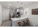 Modern kitchen with stainless steel appliances, breakfast bar, and stylish pendant lighting at 300 N Gila Springs Blvd # 181, Chandler, AZ 85226