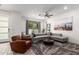 Bright living room featuring modern furnishings, ceiling fan, and sliding glass door at 300 N Gila Springs Blvd # 181, Chandler, AZ 85226