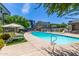 Community pool with lounge chairs and umbrellas at 300 N Gila Springs Blvd # 181, Chandler, AZ 85226