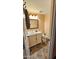 Cozy bathroom featuring a vanity and decorative mirror, creating an inviting space at 30940 N Varnum Rd, San Tan Valley, AZ 85143