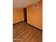 Cozy bedroom with warm-colored walls and laminate flooring, creating a tranquil and welcoming space at 30940 N Varnum Rd, San Tan Valley, AZ 85143