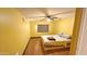 Bright bedroom featuring a ceiling fan, wood floors, and a window with a shade at 30940 N Varnum Rd, San Tan Valley, AZ 85143