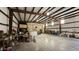 Spacious garage area with durable metal structure and concrete floors, ideal for various uses at 30940 N Varnum Rd, San Tan Valley, AZ 85143