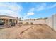 A spacious backyard with a covered patio and ample room for outdoor activities and relaxation at 3138 W Danbury Dr, Phoenix, AZ 85053