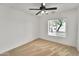 Cozy carpeted bedroom with ceiling fan and window providing ample natural light at 3138 W Danbury Dr, Phoenix, AZ 85053