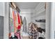 Organized walk-in closet featuring ample hanging space and shelving for storage at 3138 W Danbury Dr, Phoenix, AZ 85053