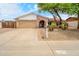 Charming single-story home with a well-maintained front yard and a spacious two-car garage at 3138 W Danbury Dr, Phoenix, AZ 85053
