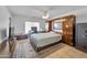 Well-appointed main bedroom with built-in storage, desk, and a comfortable bed at 3138 W Danbury Dr, Phoenix, AZ 85053