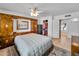Spacious main bedroom with a bed, safe, closet, and access to the ensuite bathroom at 3138 W Danbury Dr, Phoenix, AZ 85053