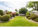 Secluded backyard with mature landscaping at 4020 W Menadota Dr, Glendale, AZ 85308