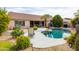 Private backyard featuring a refreshing pool and desert landscaping at 4020 W Menadota Dr, Glendale, AZ 85308