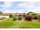 Spacious backyard features a lush lawn and well-maintained landscaping at 4020 W Menadota Dr, Glendale, AZ 85308