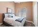 Cozy bedroom featuring a comfortable bed, soft lighting, and serene decor at 4020 W Menadota Dr, Glendale, AZ 85308