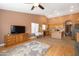 The kitchen and dining area are open to the living area and feature light-colored cabinets and stainless-steel appliances at 4020 W Menadota Dr, Glendale, AZ 85308
