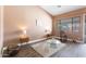 Bright living area with wood floors, neutral paint, and outdoor views at 4020 W Menadota Dr, Glendale, AZ 85308