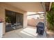 Covered patio with outdoor cooking area provides space for relaxed entertaining and grilling at 4020 W Menadota Dr, Glendale, AZ 85308