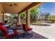Covered back porch with comfortable outdoor seating and views of the backyard trampoline at 4123 S Wayne Pl, Chandler, AZ 85249