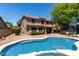 Inviting backyard with a large pool, covered patio, and outdoor seating for entertaining and relaxation at 4123 S Wayne Pl, Chandler, AZ 85249
