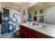 Shared bathroom offering a dual sink vanity, nautical shower curtain, and ample counter space at 4123 S Wayne Pl, Chandler, AZ 85249
