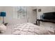Bedroom boasts a large window for natural light, neutral walls, and plush bedding at 4123 S Wayne Pl, Chandler, AZ 85249