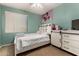 Cozy bedroom with a playful design featuring a twin bed and barn door style decor at 4123 S Wayne Pl, Chandler, AZ 85249