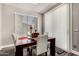 Dining room features a wood table, bright windows, light walls, and vertical blinds at 4123 S Wayne Pl, Chandler, AZ 85249