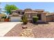 Stunning two-story home with a three-car garage, tile roof, and desert landscaping for curb appeal at 4123 S Wayne Pl, Chandler, AZ 85249