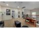 Spacious loft area with neutral carpet, black furniture, and access to multiple rooms at 4123 S Wayne Pl, Chandler, AZ 85249