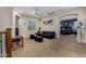 Loft with view to bedroom features carpet, black furniture, and a window with natural light at 4123 S Wayne Pl, Chandler, AZ 85249