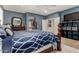 Comfortable main bedroom featuring blue walls, wood furniture, and access to a large walk-in closet at 4123 S Wayne Pl, Chandler, AZ 85249