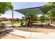 Community playground with slide, climbing equipment, swings, and covered shade area for children to enjoy at 4123 S Wayne Pl, Chandler, AZ 85249