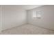 Bright carpeted bedroom with neutral walls and natural light at 42895 W Palo Amarillo Rd, Maricopa, AZ 85138
