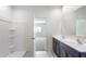 Bathroom showcases a dual sink vanity adjacent to a shower with a built in seat at 42900 W Palo Amarillo Rd, Maricopa, AZ 85138