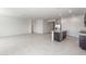 Open floor plan featuring a kitchen with an island, dining area, and living room at 42900 W Palo Amarillo Rd, Maricopa, AZ 85138