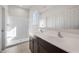 Bathroom featuring a double sink vanity and shower at 42930 W Palo Amarillo Rd, Maricopa, AZ 85138