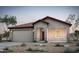 Charming single-story home features a tiled roof, two-car garage, and desert landscaping at 42930 W Palo Amarillo Rd, Maricopa, AZ 85138