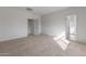 Spacious bedroom with neutral carpet and a walk-in closet at 42945 W Palo Amarillo Rd, Maricopa, AZ 85138