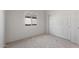 Bedroom with neutral carpet and sliding door closet at 42945 W Palo Amarillo Rd, Maricopa, AZ 85138