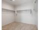 Walk-in closet with built in shelving at 42945 W Palo Amarillo Rd, Maricopa, AZ 85138
