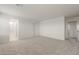 Spacious bedroom with neutral carpet and attached bathroom for easy access and convenience at 42950 W Palo Amarillo Rd, Maricopa, AZ 85138